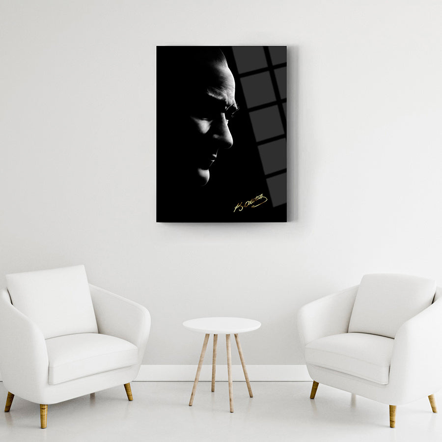 Artistically framed Atatürk black and white silhouette artwork on the wall above a modern seating area.