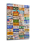 Colorful collage of vintage license plates beautifully displayed on glass, showcasing unique designs and patterns.