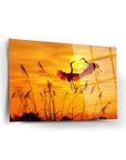 Sazlık Leylekleri Cam Tablo with elegant herons silhouetted against a vibrant sunset background.
