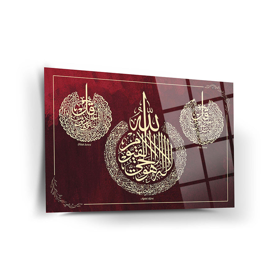 Ayetel Kürsi Felak Nas cam tablo with elegant gold calligraphy on a rich red background.