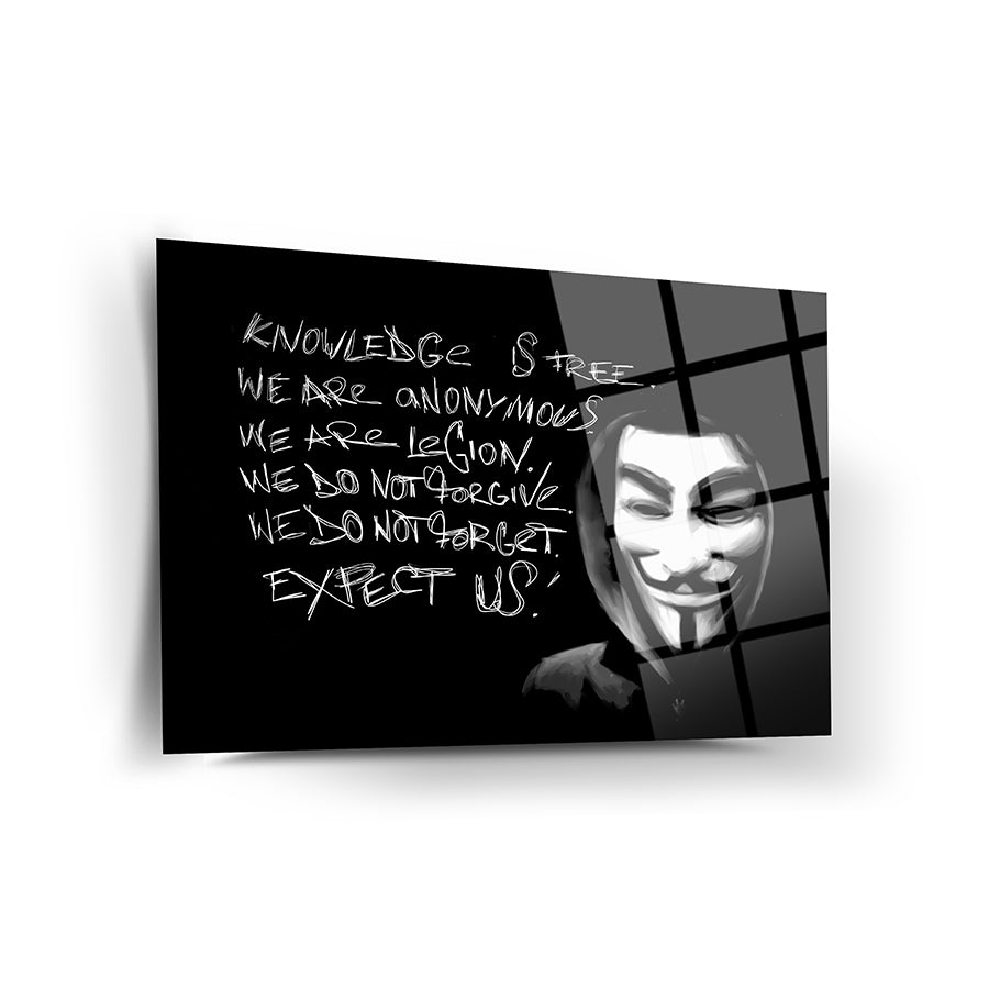 Artistic print featuring a masked figure with the text 'Knowledge is free. Expect us.' on a black background.