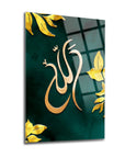Elegant glass art featuring the word 'Allah', adorned with golden leaves on a green background.