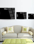 Modern black glass table sizes displayed above a stylish sofa, showcasing 100cm, 70cm, 65cm, 45cm, and 30cm options.
