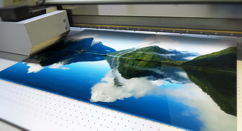 UV printing process showing a landscape image being printed on a large format printer.