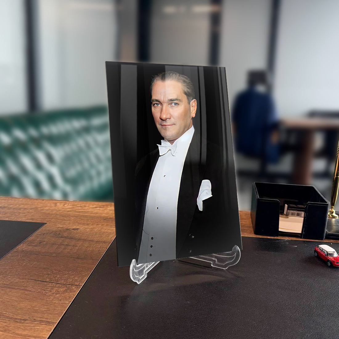 Atatürk 145 Cam Tablo on a desk, showcasing a high-quality UV printed glass design with a stylish holder.