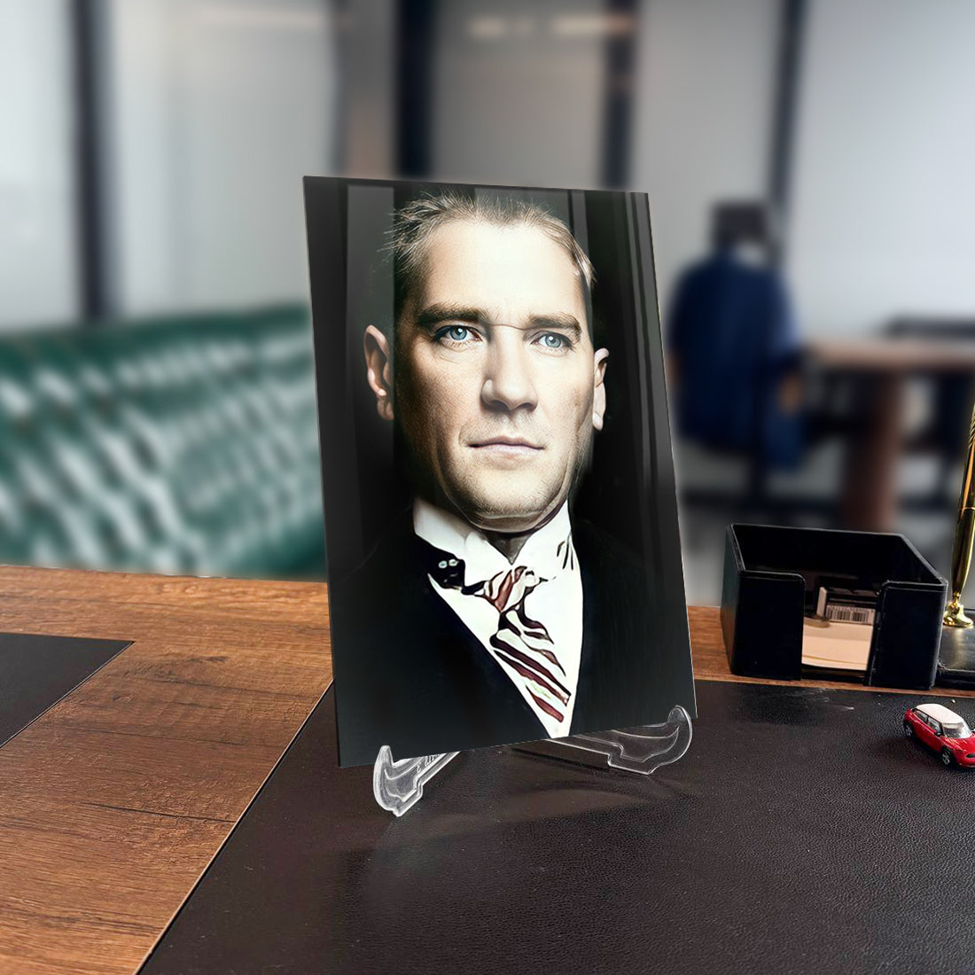 Atatürk 111 Cam Tablo on a desk, showcasing its elegant design and high-quality glass material.