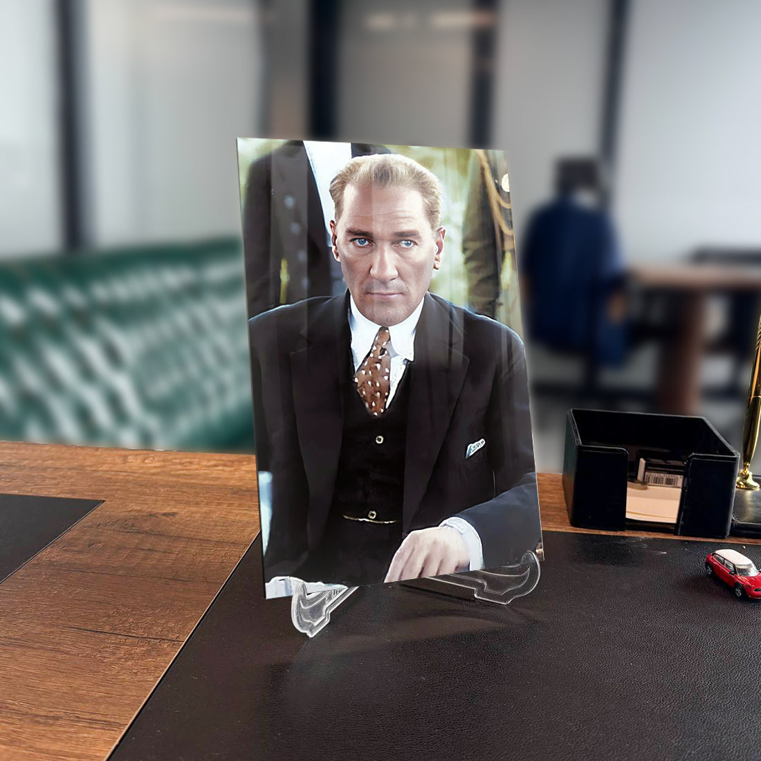 Atatürk 144 Cam Tablo on display in a stylish office setting, showcasing high-quality UV printing on glass.