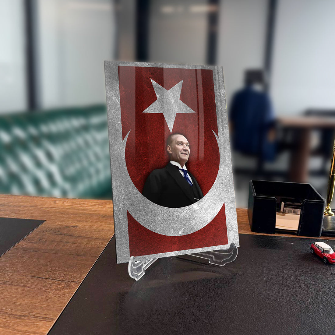 Atatürk 223 glass plaque with Turkish flag design on a desk, showcasing high-quality tempered glass.
