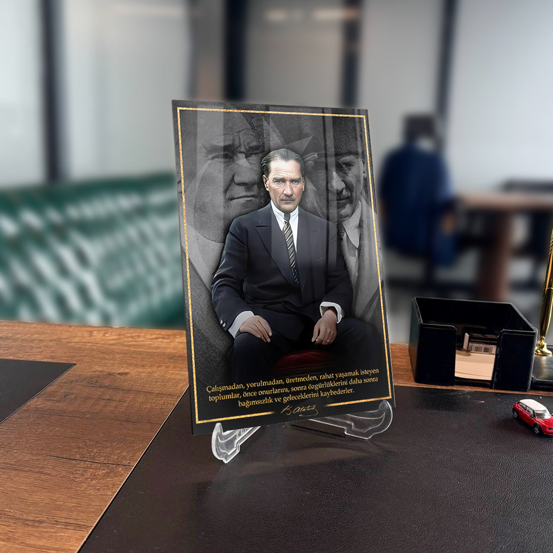 Atatürk 228 Cam Tablo on a desk, showcasing high-quality UV printing and elegant design for home decor.
