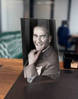 Atatürk 137 Cam Tablo on a desk, showcasing high-quality tempered glass with a modern design in an office setting.