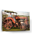 Atatürk 249 Cam Tablo featuring a vintage red tractor with a man dressed in formal attire.